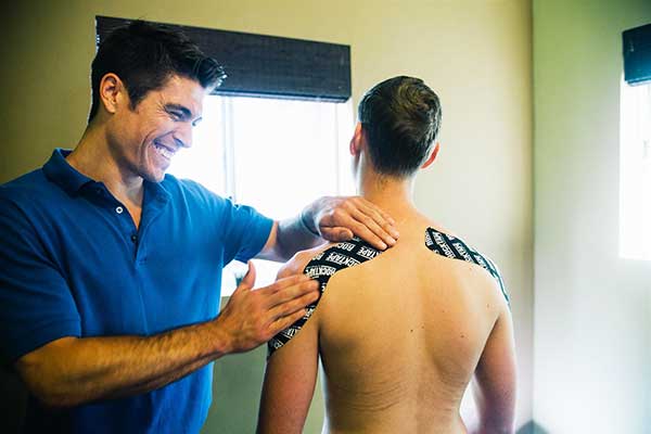 Chiropractor San Francisco CA Dr. Nick Cruze Kinesiotaping Patient